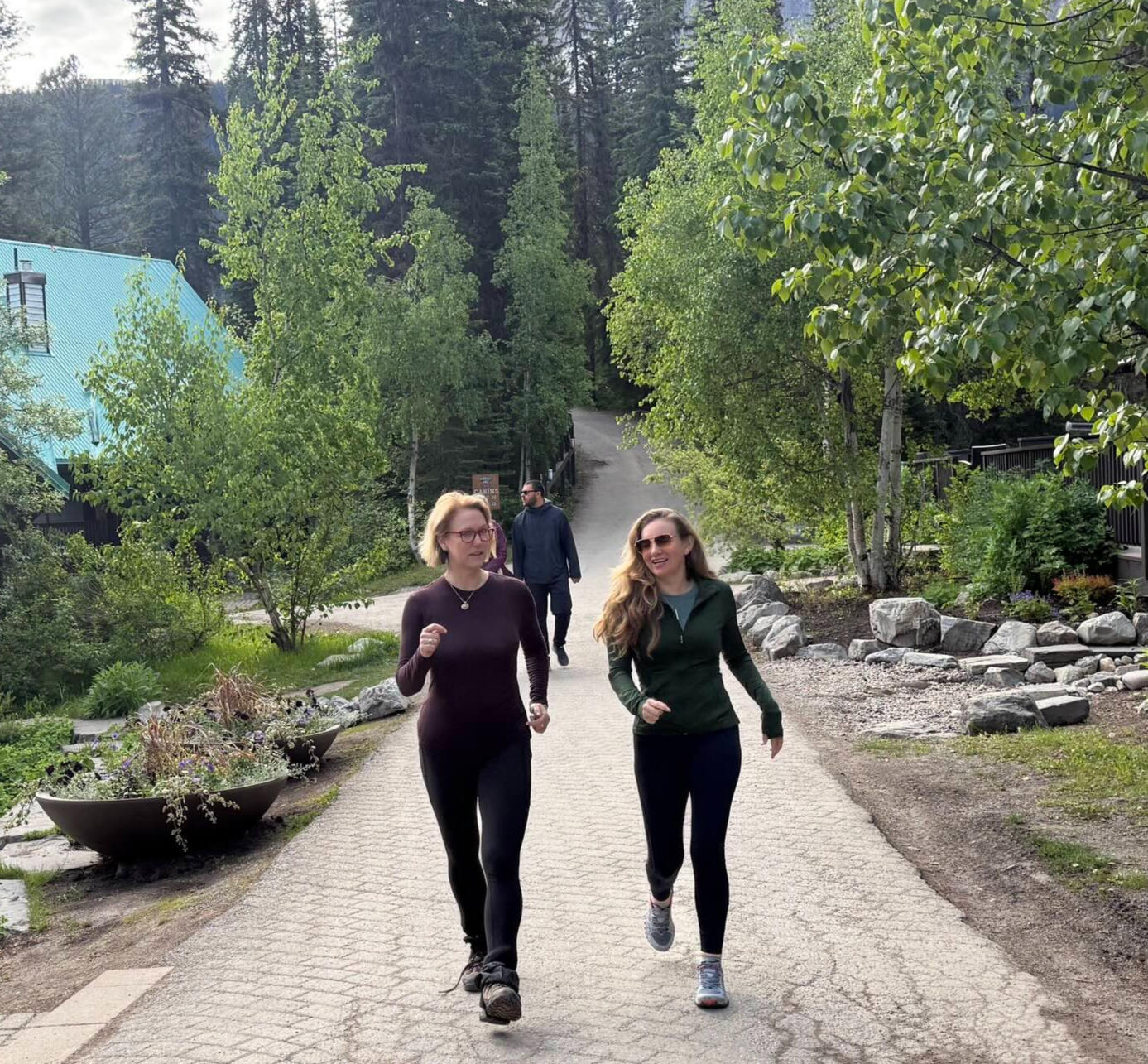 Jen Nash, founder of The Walking Coach, walking in Banff, Canada Two women power walking on the streets around Lake Louise.